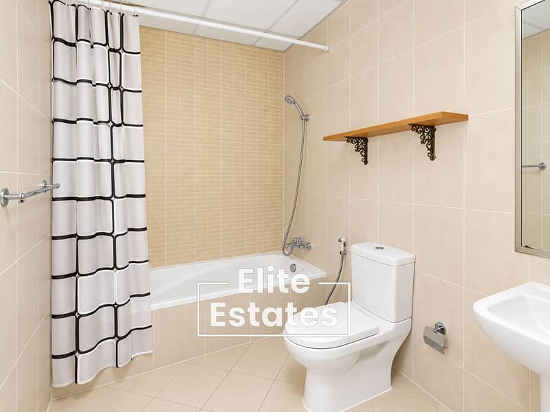 12 Bright Minimalist Beige Tiled Bathroom. png
