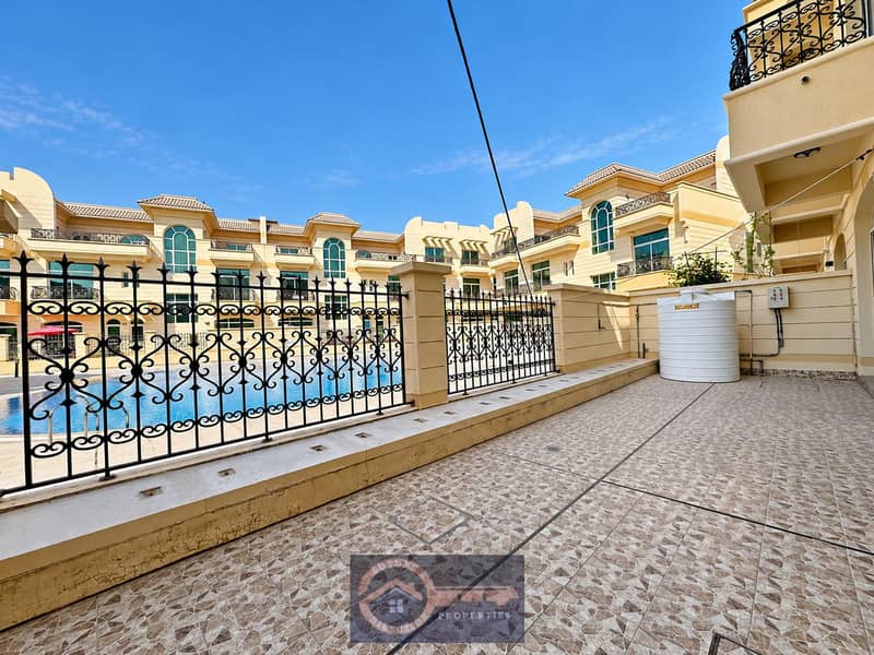 4 Sunlit Pool Terrace With Cream Buildings (1). png