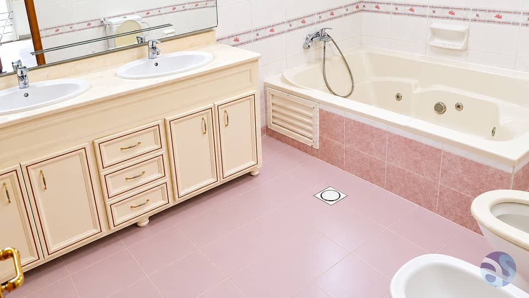 12 Elegant Cream and Rose-Tiled Bathroom. png