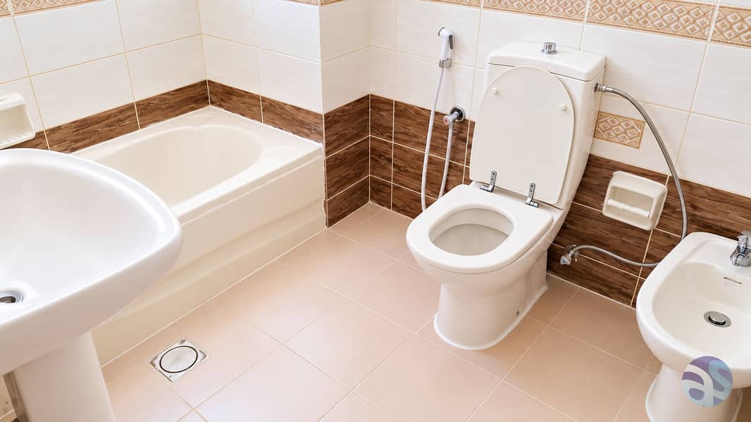 16 Bright Modern Beige-Tiled Bathroom. png