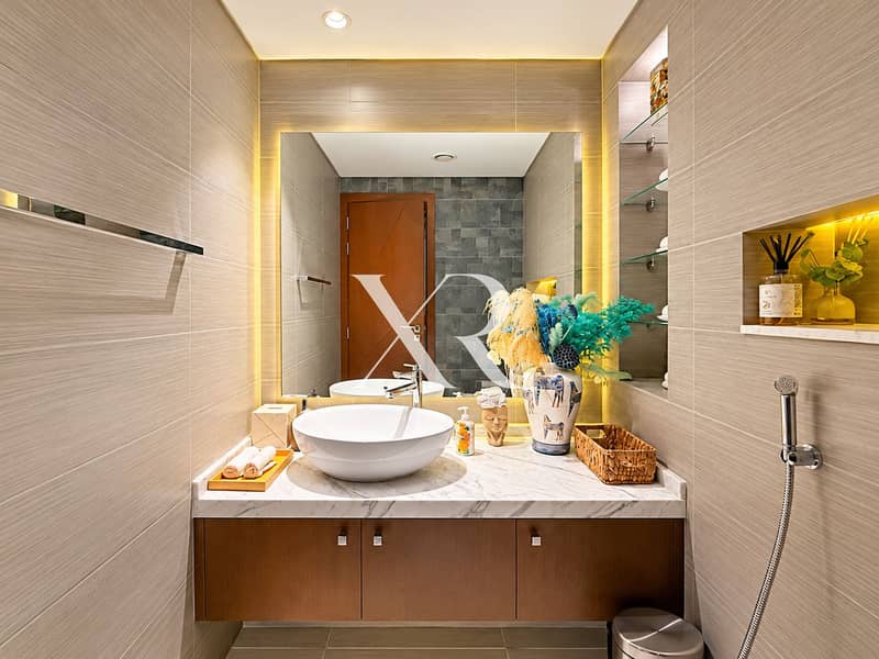 10 Warmly Lit Modern Bathroom Vanity. png