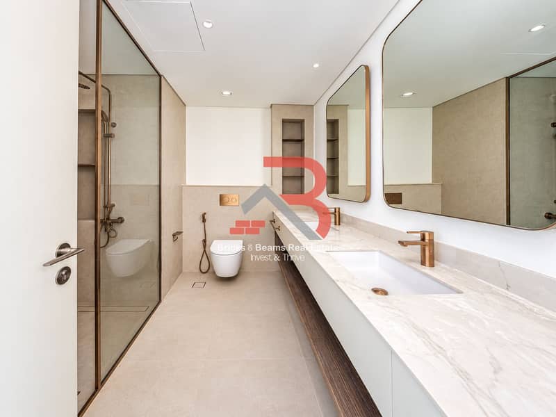 15 Modern Warm-Toned Double Vanity Bathroom. png