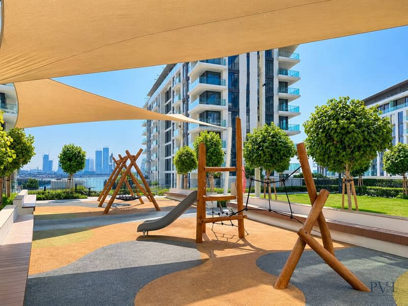 18 Modern Waterfront Playground Under Shade Sails. jpeg