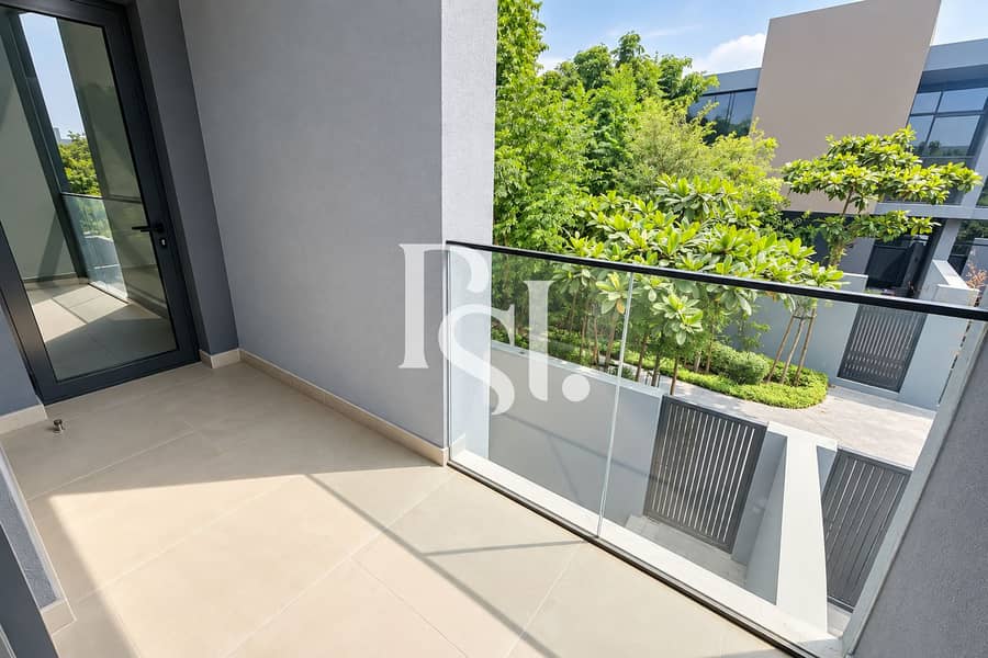 3 Modern Balcony Overlooking Lush Villas. png