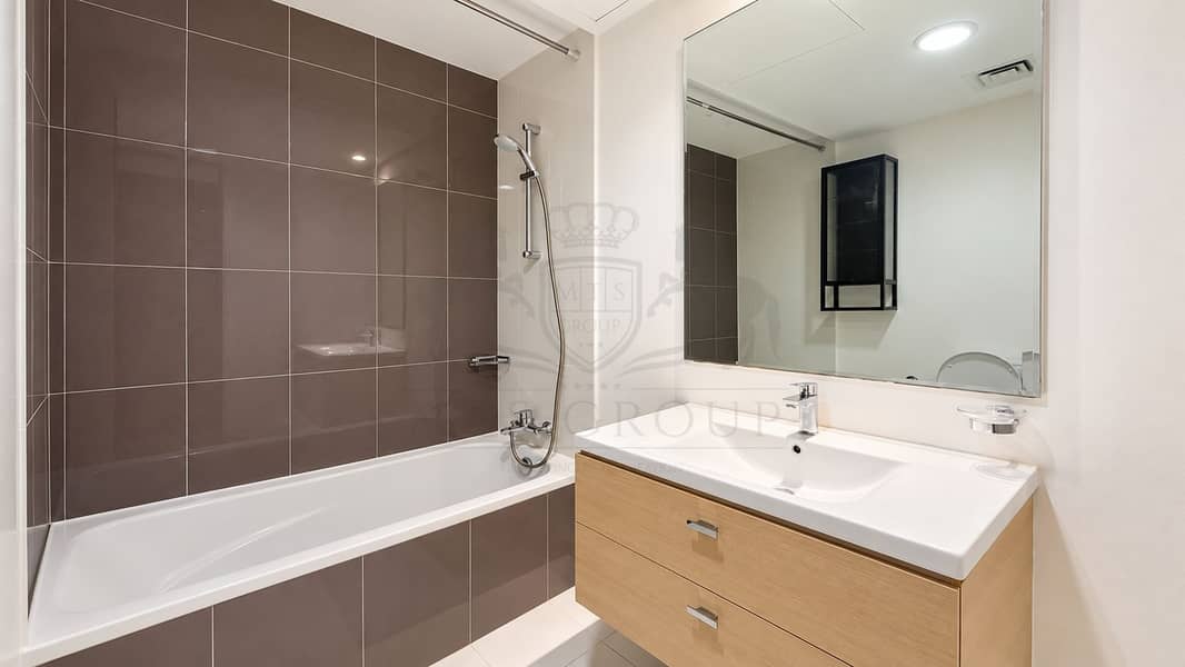 6 Modern Taupe-Tiled Bathroom Interior. png