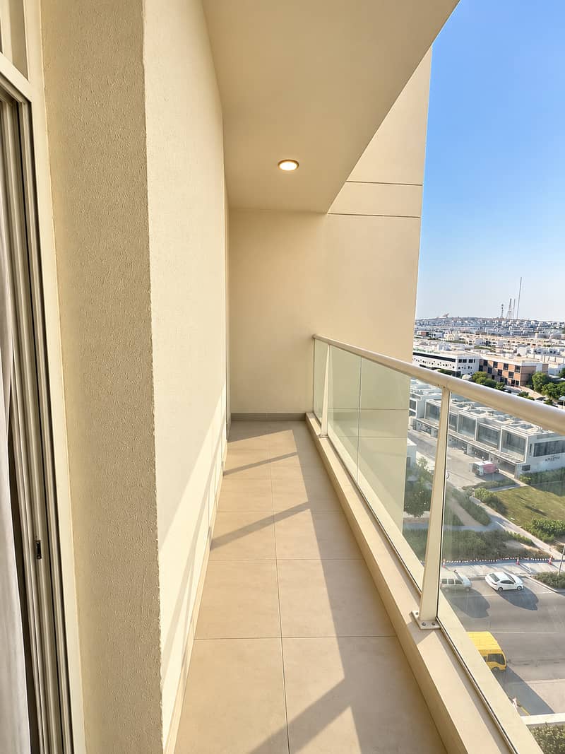 2 Sunlit Minimalist Balcony Overlooking the City. png