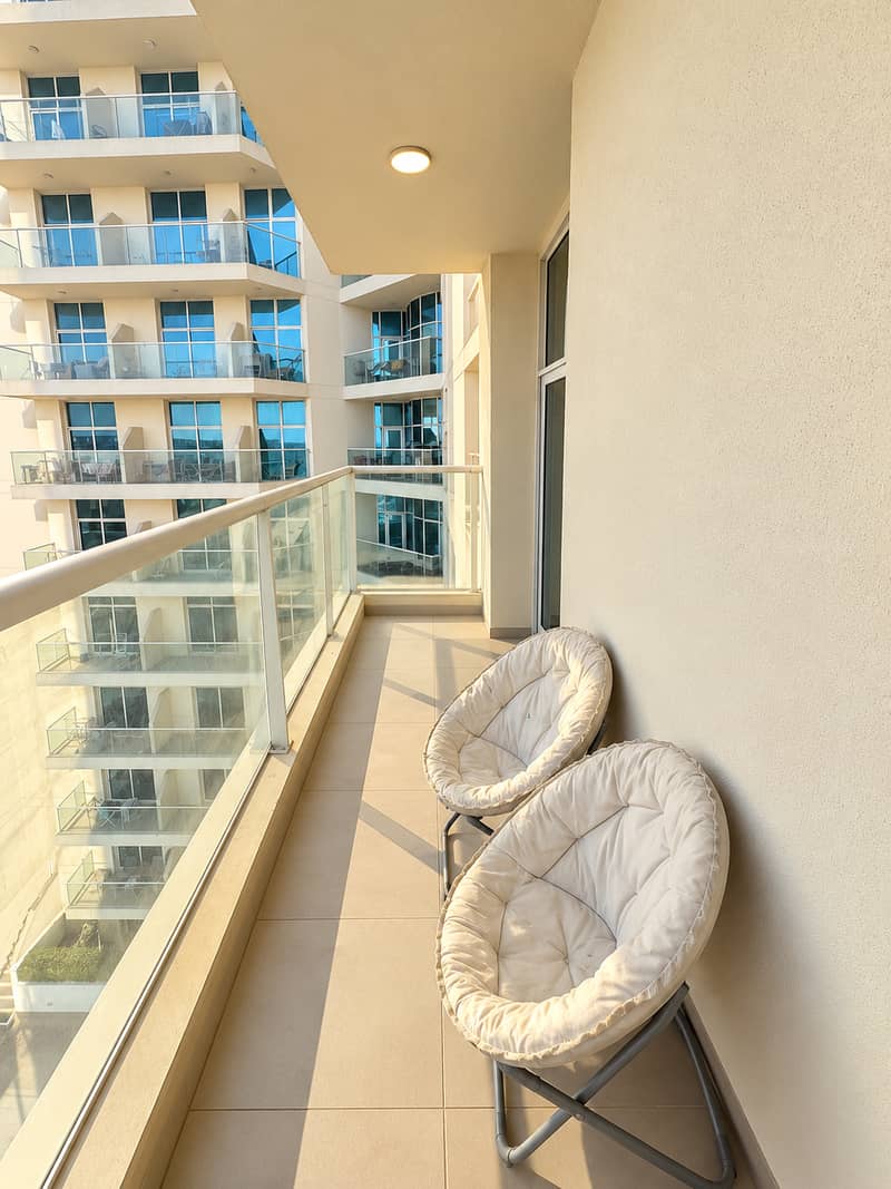 3 Minimalist Balcony with Two Lounge Chairs. png