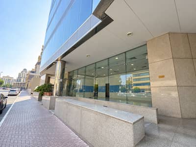 Showroom for Rent in Bur Dubai, Dubai - Sticker-Free Modern Glass Entrance. png Showroom for Rent in Bur Dubai, Dubai - Sticker-Free Modern Glass Entrance. png