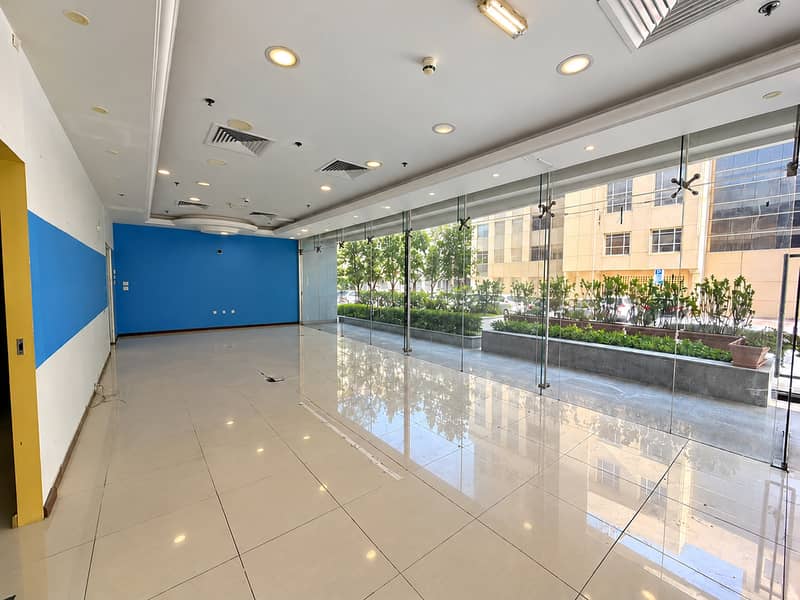 3 Vacant Blue-Accent Glassfront Lobby. png
