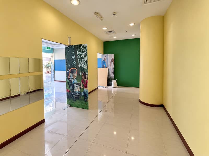 7 Bright Clinic Hallway with Family Poster. png