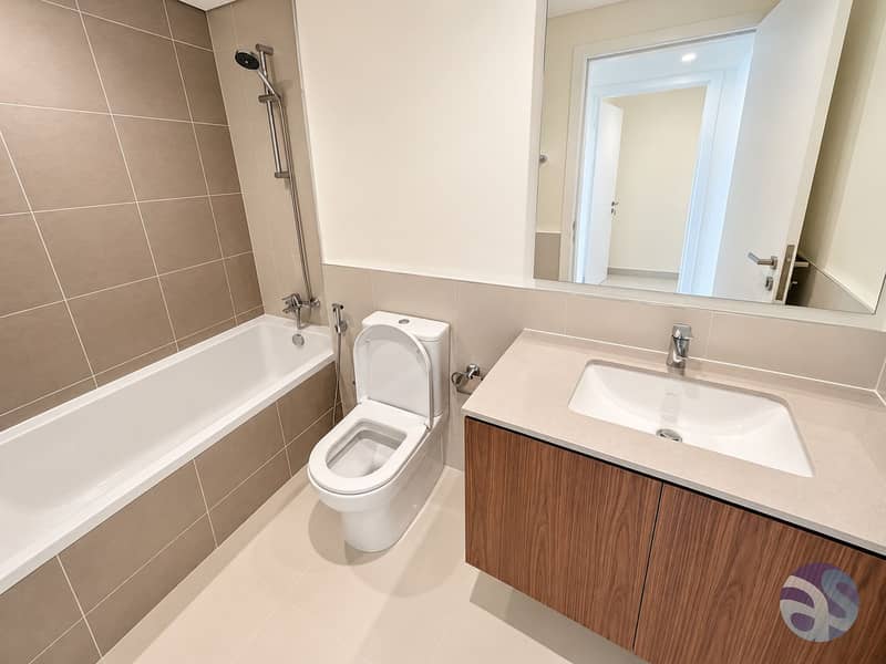 13 Modern Taupe and Wood Bathroom. png
