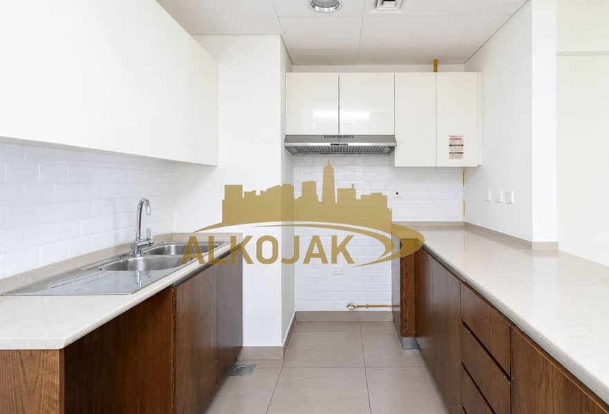 5 Bright Minimalist Galley Kitchen. png
