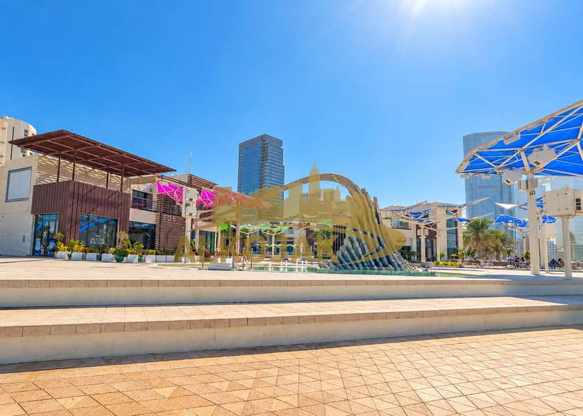 25 Sunny Modern Plaza with Sculptural Fountain. png