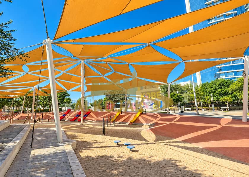 28 Vibrant Kobe Playground Under Shade Sails. png