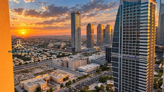 2 Bedroom Flat for Rent in Jumeirah Lake Towers (JLT), Dubai - Golden Hour Cityscape with Armada Tower. png