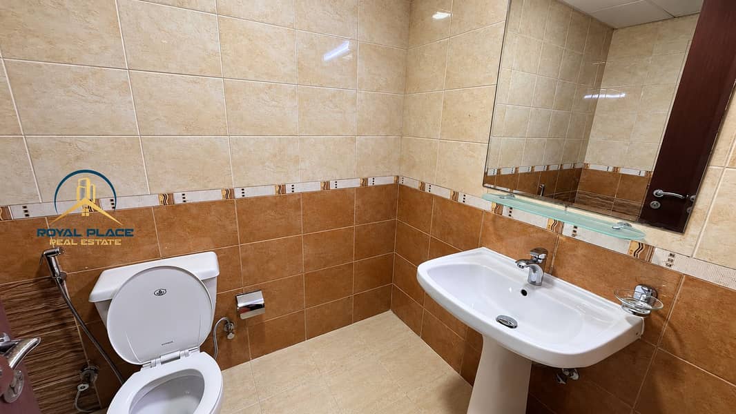 6 Modern Beige and Brown Tiled Bathroom. png