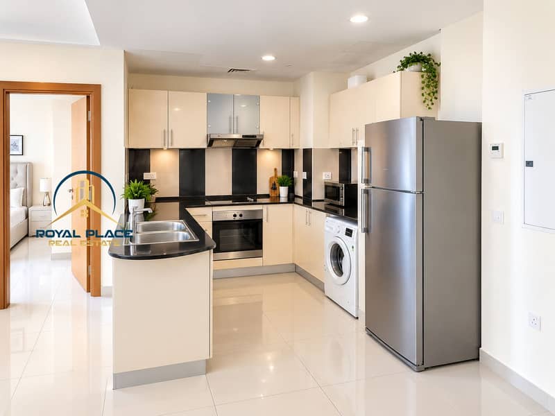 6 Bright Modern Kitchen with Open Bedroom Entry. png