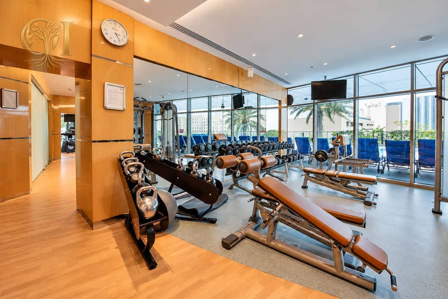 18 Upscale Gym with Kettlebells and City Views. png
