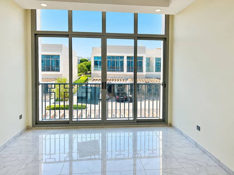 7 Sunlit Modern Room with Balcony Views. png