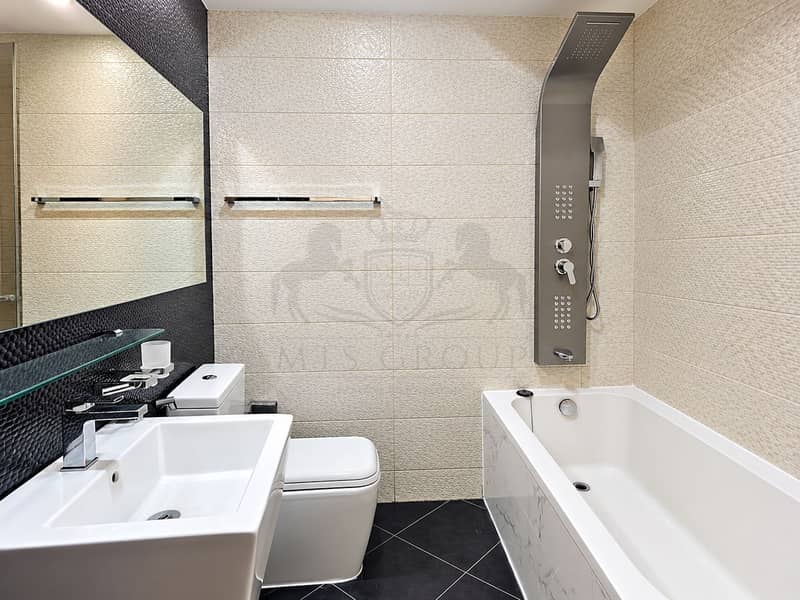 9 Modern Textured Bathroom with Rainfall Shower. png