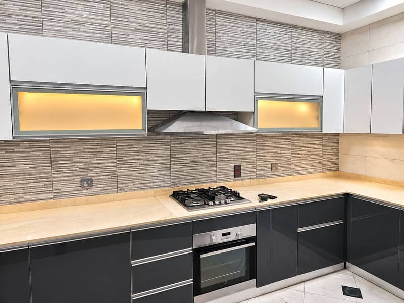 12 Modern Minimalist Kitchen with Warm Lighting. png