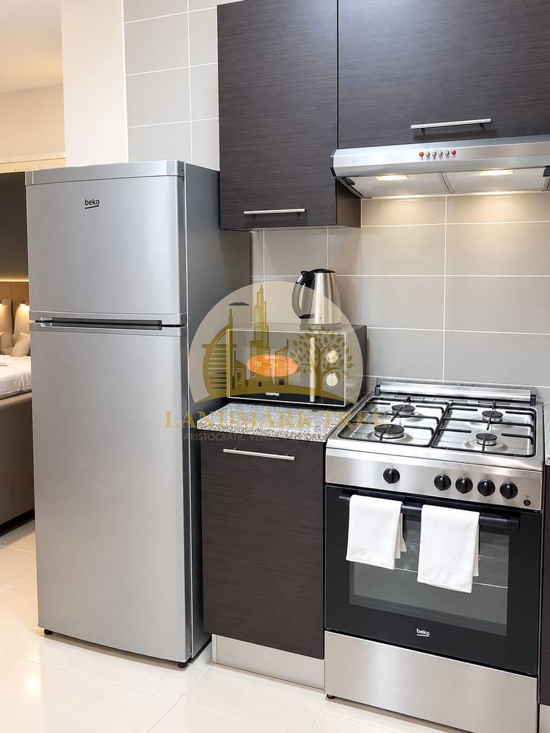 5 Modern Compact Kitchen with Stainless Appliances. png