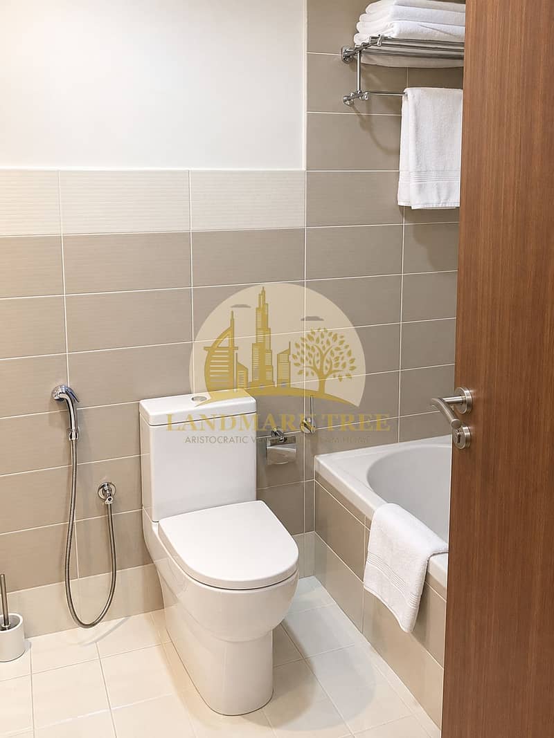 8 Modern Neutral Bathroom with Bathtub and Towels. png