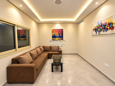 1 Bedroom Flat for Rent in Al Sa'adah, Abu Dhabi - Warm Minimalist Lounge with Autumn Artwork. png 1 Bedroom Flat for Rent in Al Sa'adah, Abu Dhabi - Warm Minimalist Lounge with Autumn Artwork. png