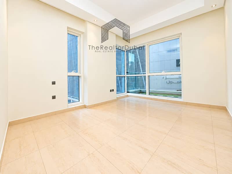 9 Minimalist Cream Interior with Corner Windows. png