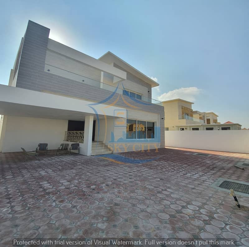 Modern design villa, excellent location, less than a minute, on Sheikh Ammar bin Humaid Street, Carvo Hill, and the Saudi German Hospital