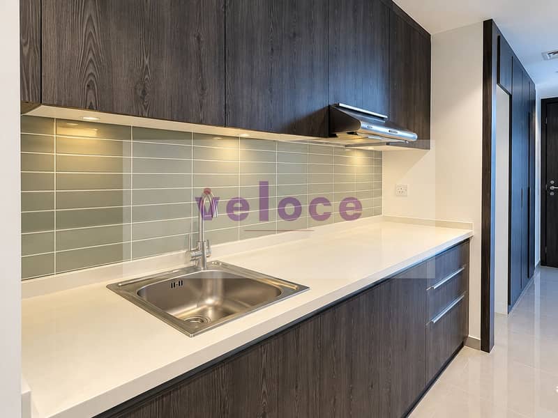 4 Modern Galley Kitchen with Sage Backsplash. png