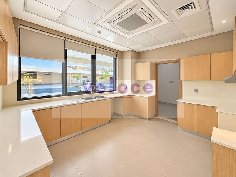 7 Bright Minimalist Kitchen with Street View. png