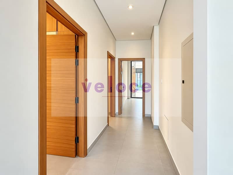11 Modern Minimalist Hallway with Wood Accents. png