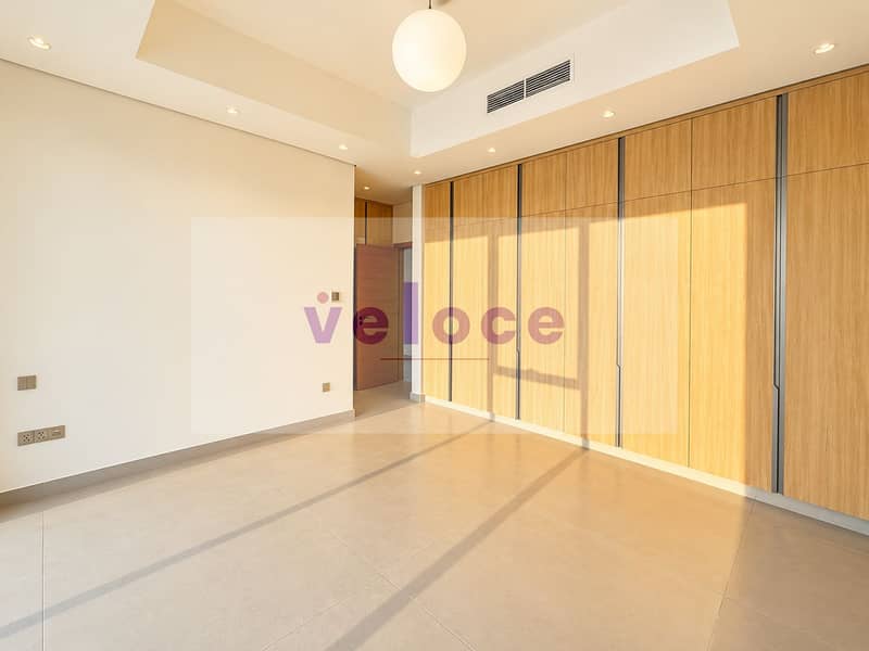 12 Sunlit Minimalist Bedroom with Wood Wardrobes. png