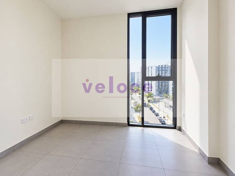 4 Sunlit Minimalist Room with City View. png