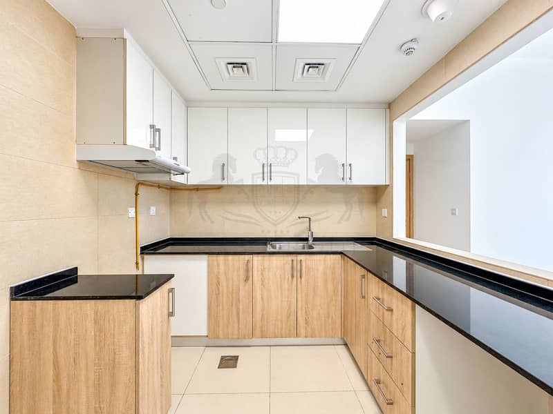 11 Bright Minimalist Kitchen with Black Counters. png