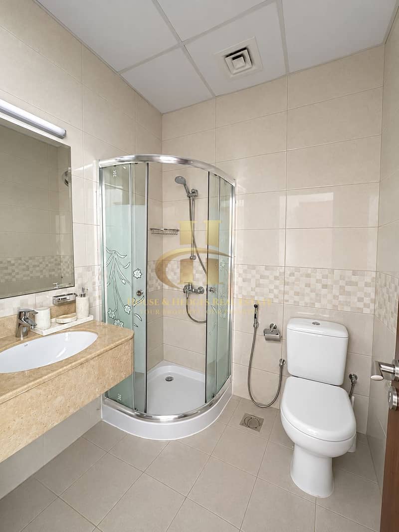 5 Modern Beige-Tiled Hotel Bathroom. png