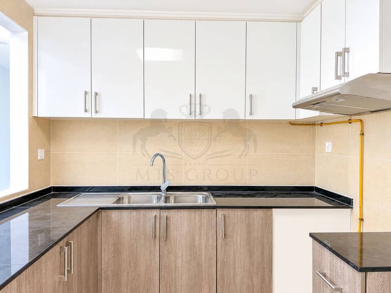 16 Bright Modern Kitchen with Stainless Sink. png