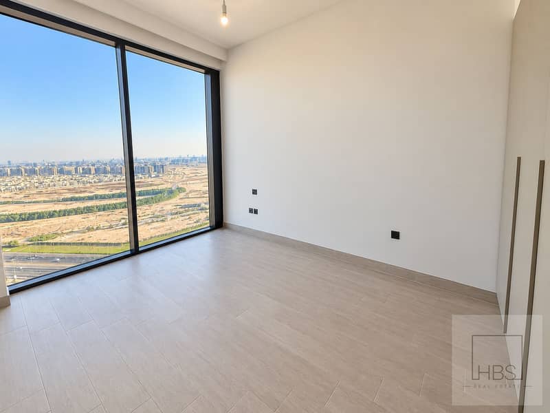 3 Sunlit Empty Room with City Views. png