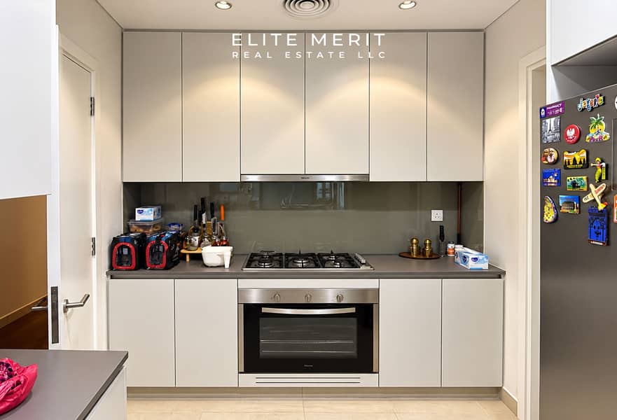 5 Modern Cream Kitchen with Travel-Magnet Refrigerator. jpg