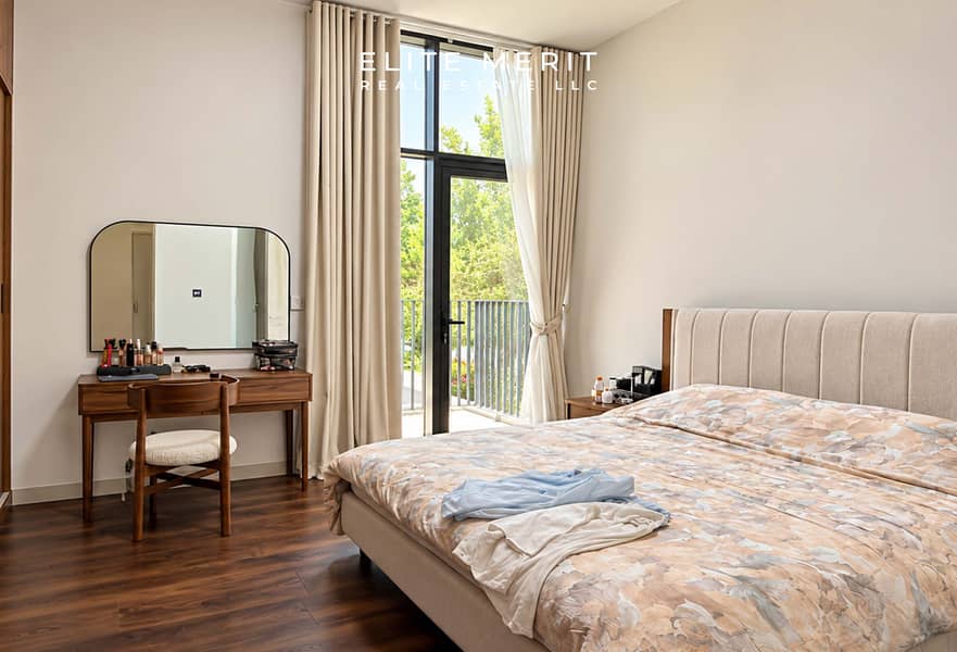 7 Modern Beige Bedroom with Balcony Views. jpg