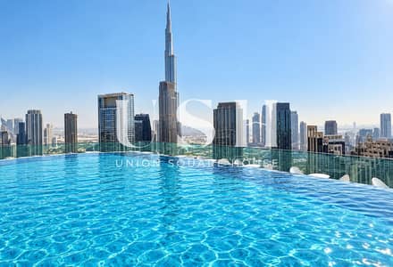شقة فندقية  للبيع في الخليج التجاري، دبي - Rooftop Infinity Pool Over Dubai. png
