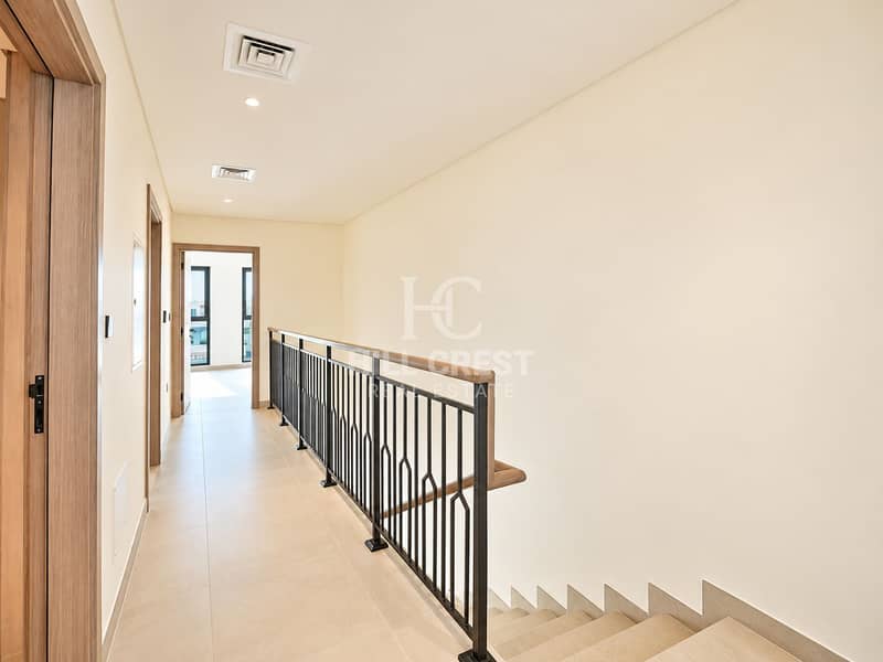 4 Modern Cream-Tiled Hallway with Stair Railing. png