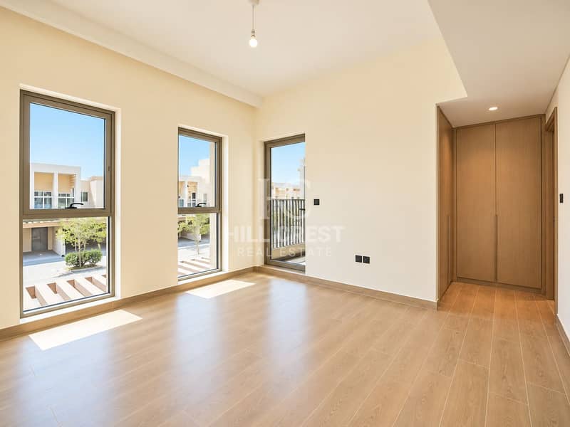 7 Bright Minimalist Room with Balcony Views. png