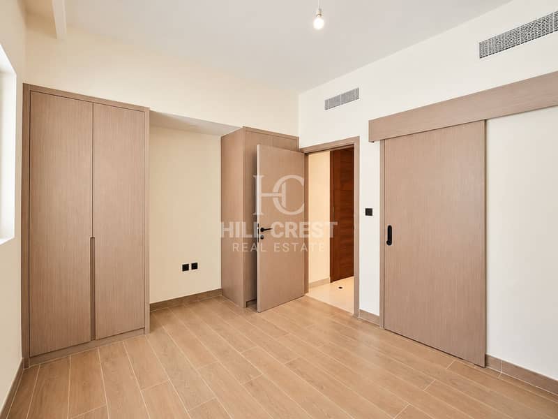 13 Minimal Neutral Bedroom with Wood Doors. png
