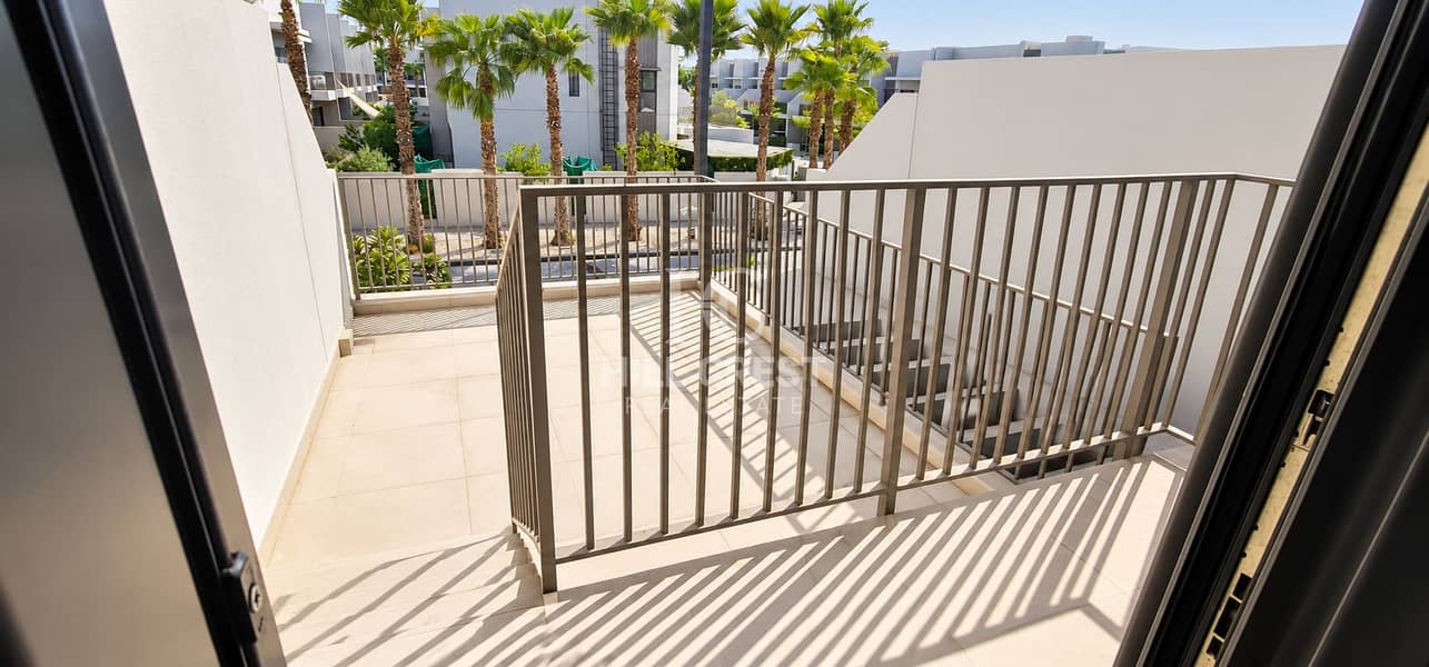 18 Sunlit Modern Balcony with Palm Views. png