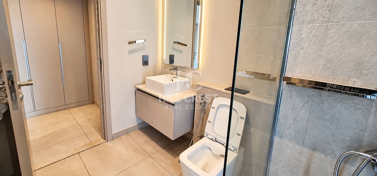 19 Modern Beige Bathroom with Illuminated Mirror. png