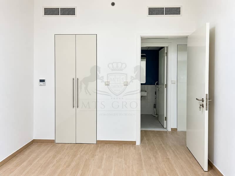 7 Minimal Modern Room with Open Bathroom Door. png