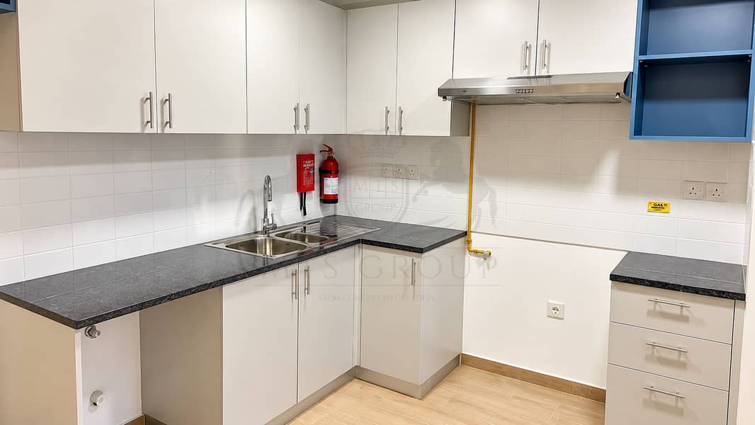 10 Modern White Kitchen with Safety Features. png