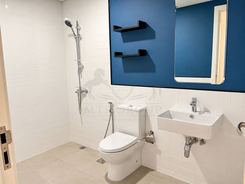 12 Modern Blue-Accent Minimalist Bathroom. png